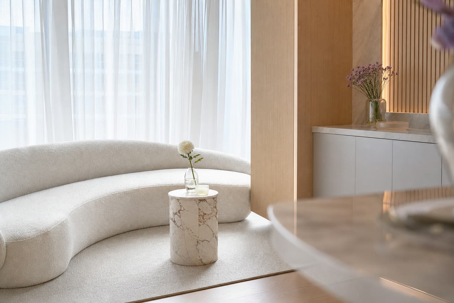 Calm private clinic consultation corner with soft ivory tones